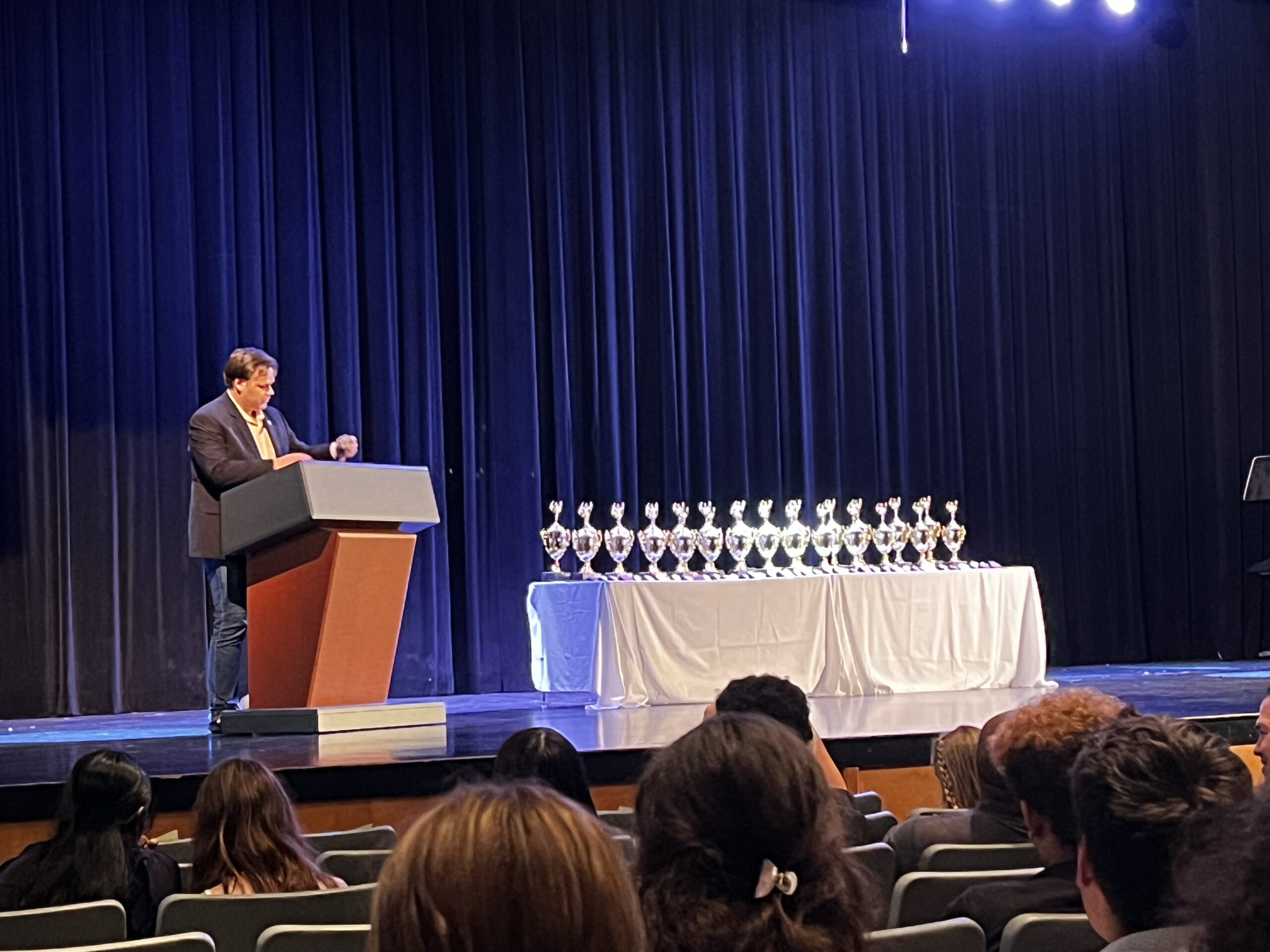 The stage with trophies before they were given out at the Wakefield Flying L speech/debate tournament in late 2023